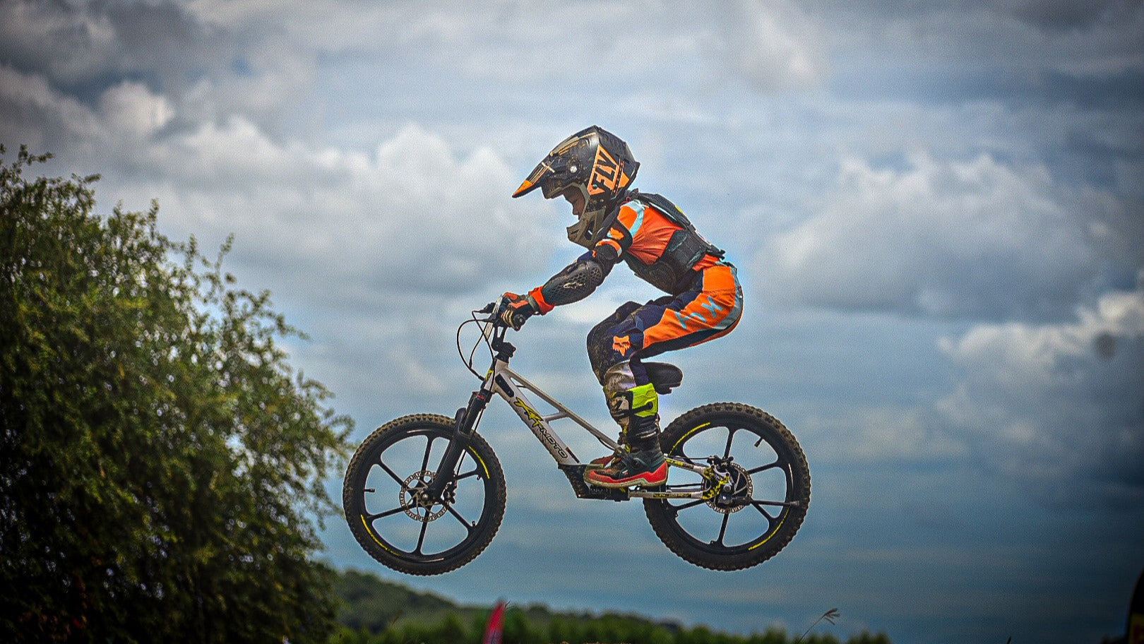 high_bike_jump_e-bike_kid_childrent_20in_rebel_extreme_race_ebike_electric_motocross